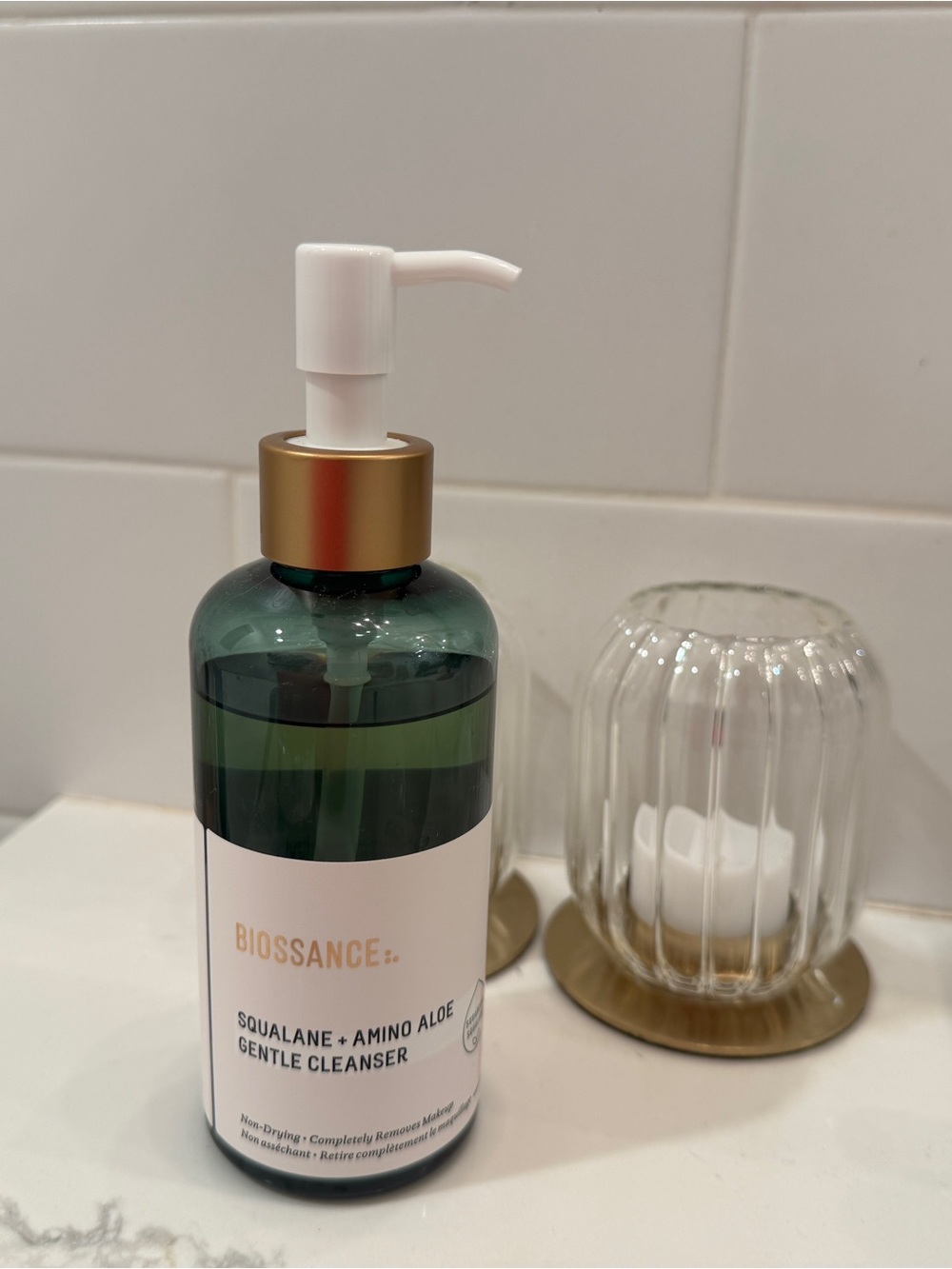 Biossance green and gold pump facial cleanser